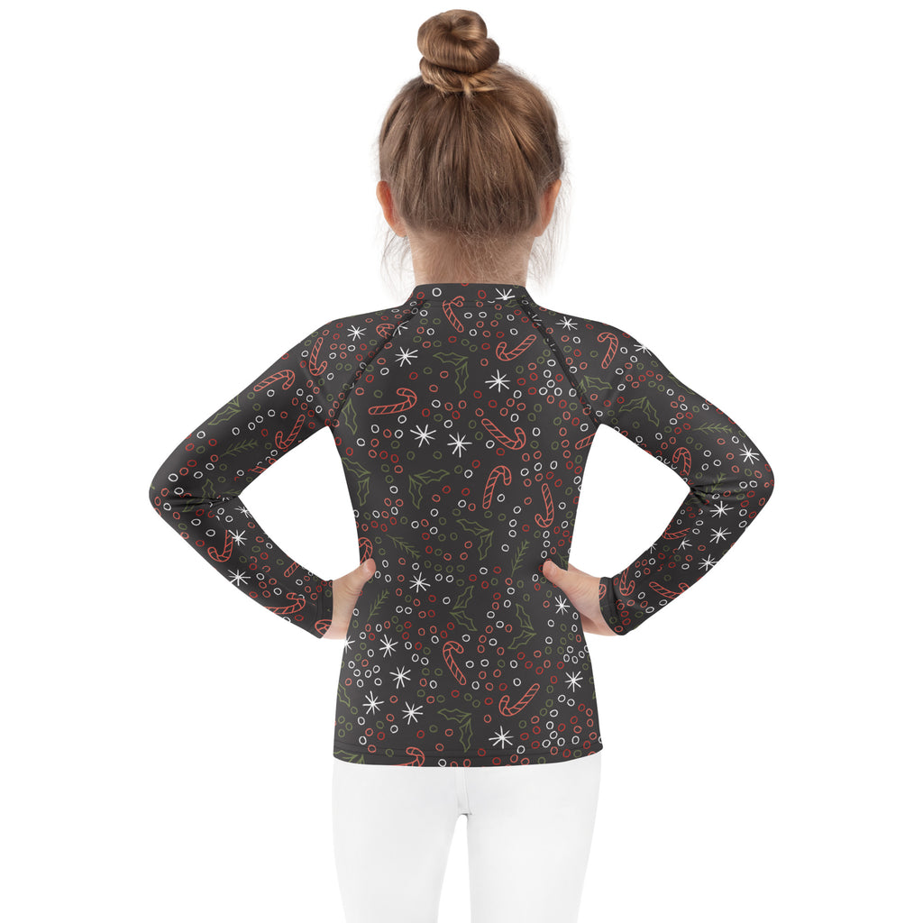 Kids candy cane and holly christmas long sleeve black rash guard swim shirt with upf 50 plus and festive patterns