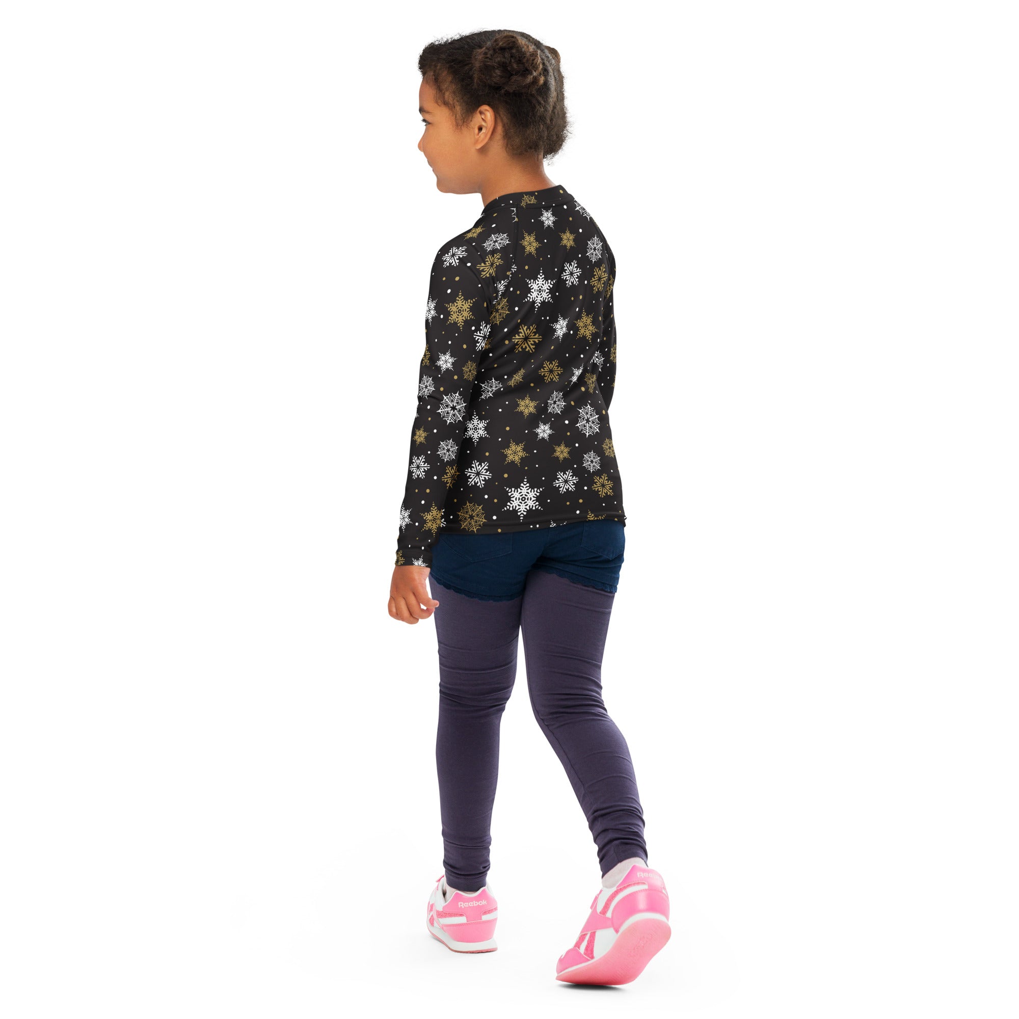 Black long-sleeved kids rash guard swim shirt with white and gold snowflake pattern and upf 50 plus protection