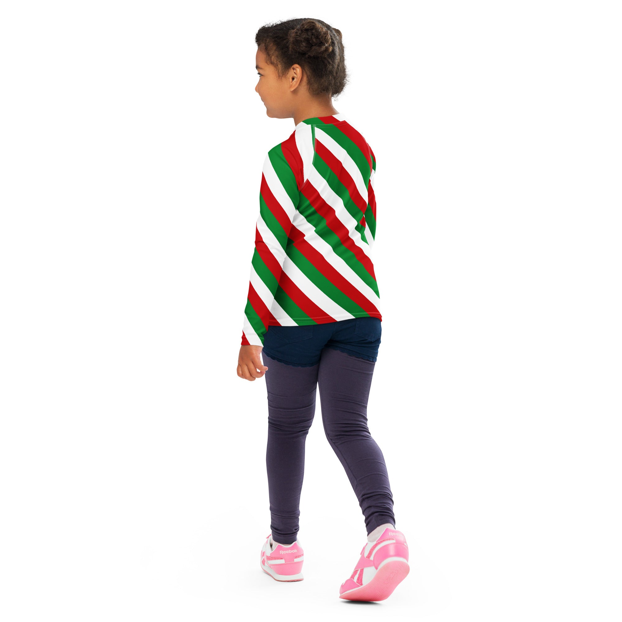 A child wearing a kids bold candy cane stripe Christmas long sleeve rash guard swim shirt with UPF 50+ in red green and white