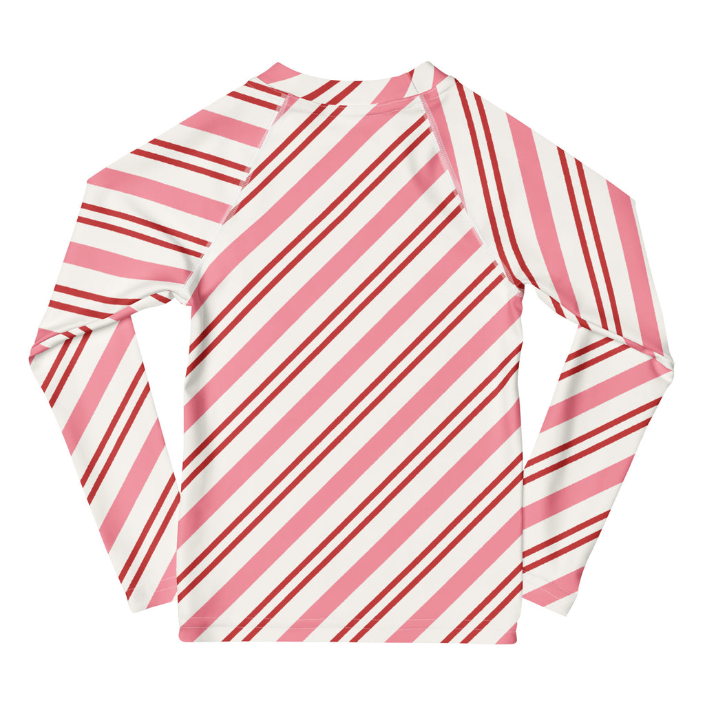 Kids pink peppermint stripe christmas long sleeve rash guard swim shirt with diagonal pink and white stripes and upf 50+