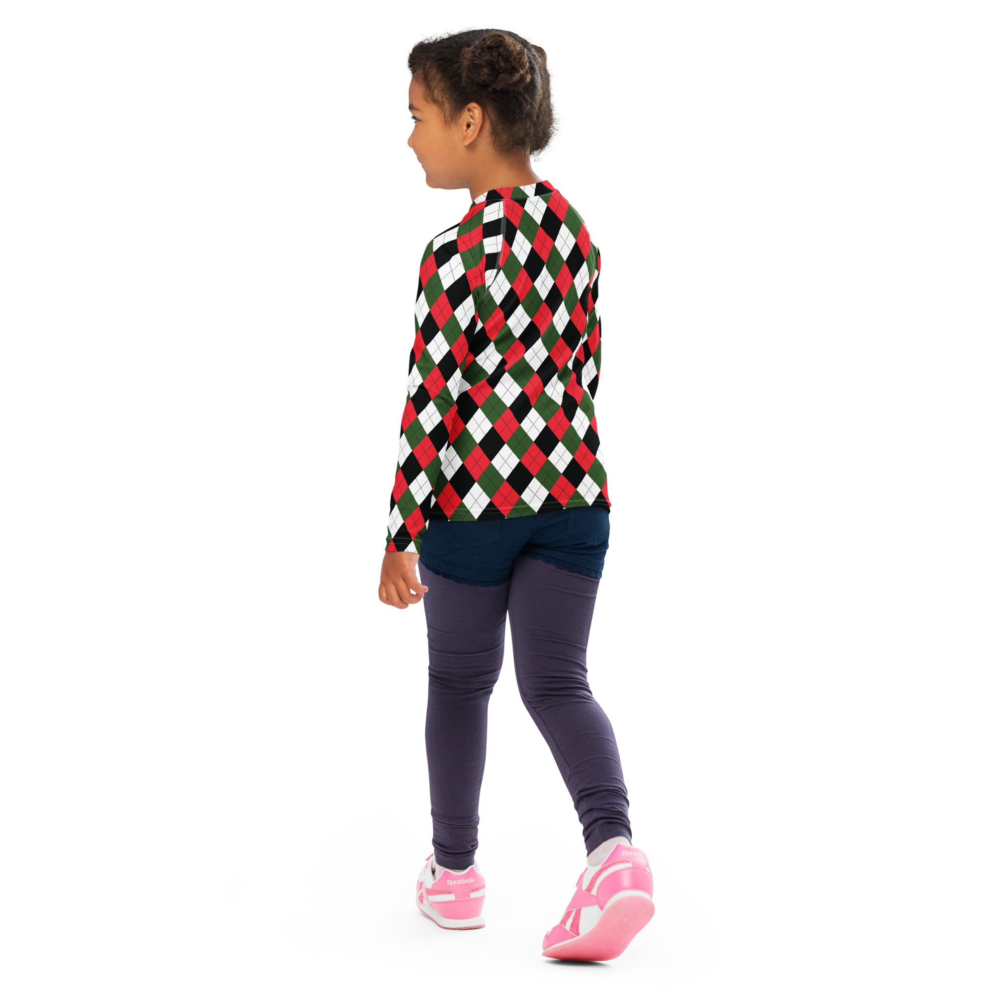 A child wearing a kids christmas argyle long sleeve rash guard swim shirt with upf 50 plus in red green black and white