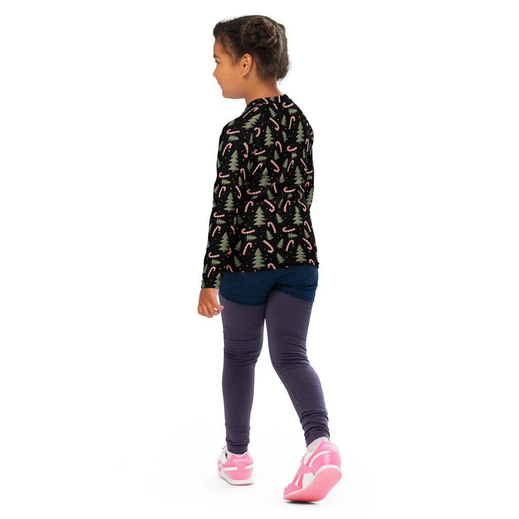 Kids candy cane and christmas tree long sleeve rash guard swim shirt in black with festive pink candy canes and green pines