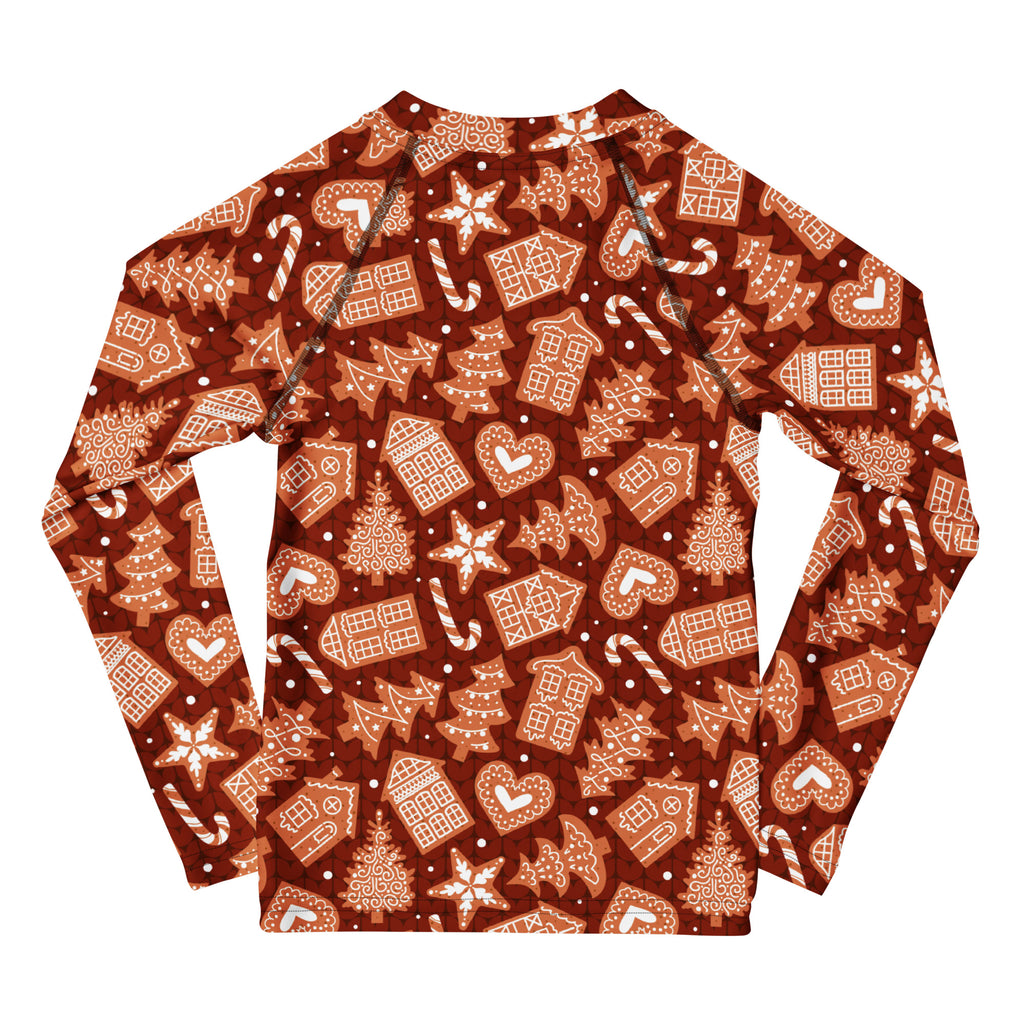Kids red gingerbread Christmas long sleeve rash guard swim shirt with UPF 50 plus featuring festive beige and white patterns