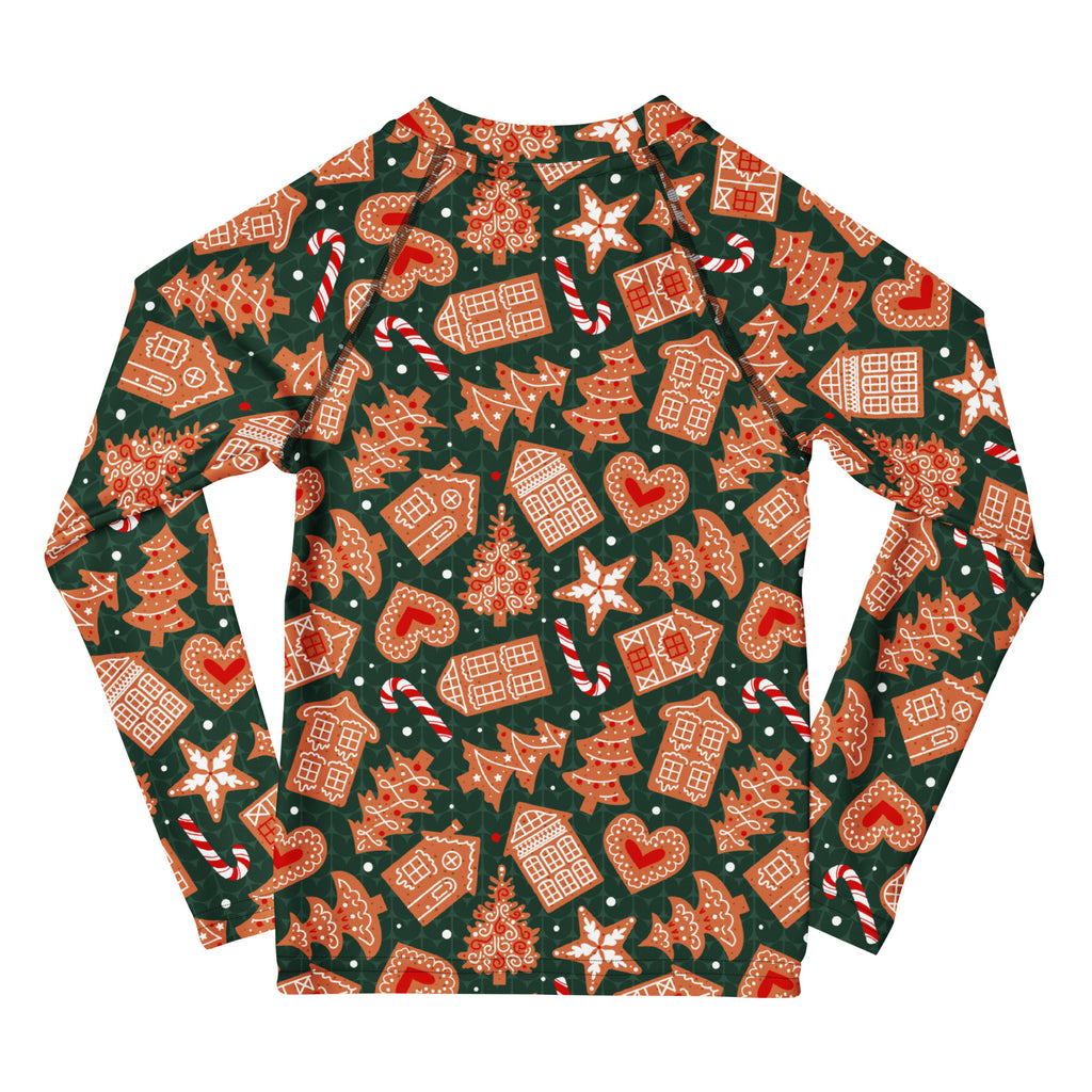 Kids green long sleeve rash guard swim shirt with festive gingerbread house pattern and upf 50 plus sun protection