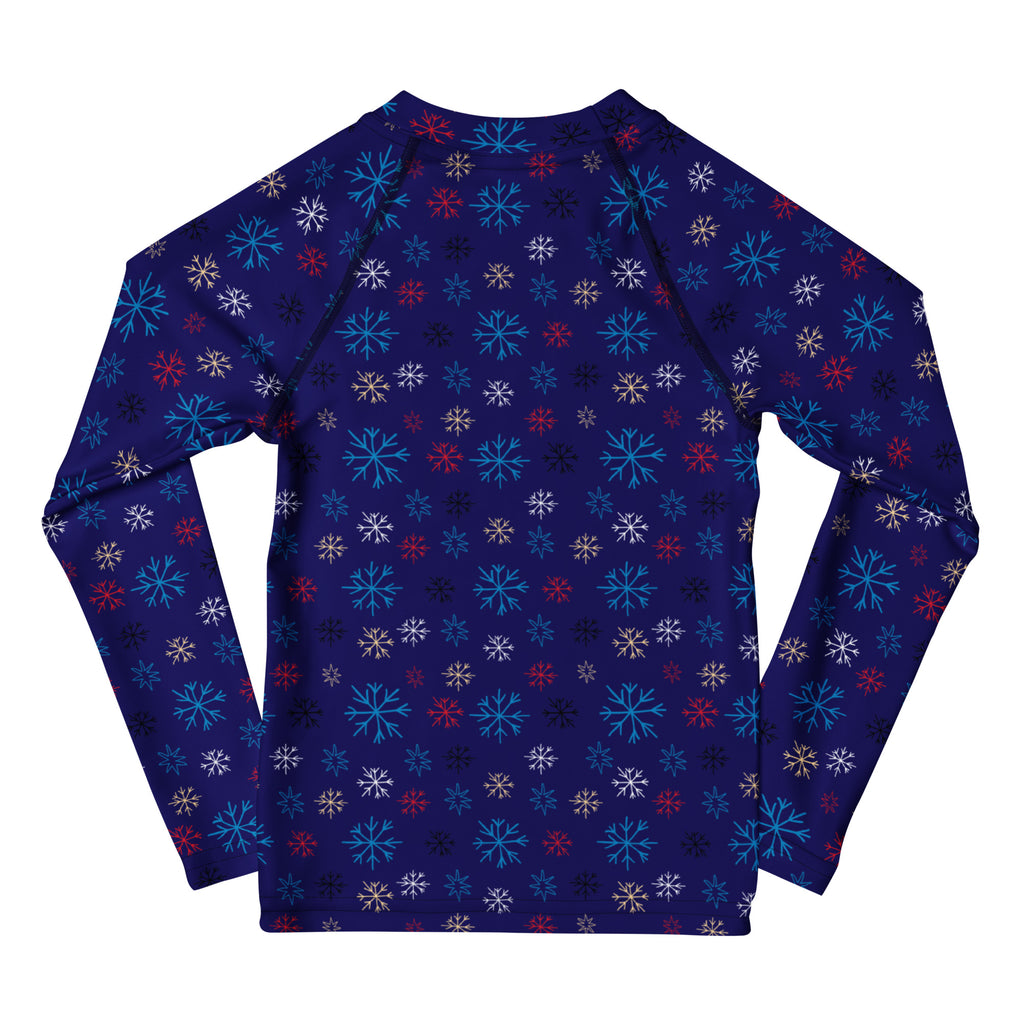 Kids navy blue long sleeve rash guard swim shirt with vibrant teal red and white snowflake pattern and UPF 50 plus protection