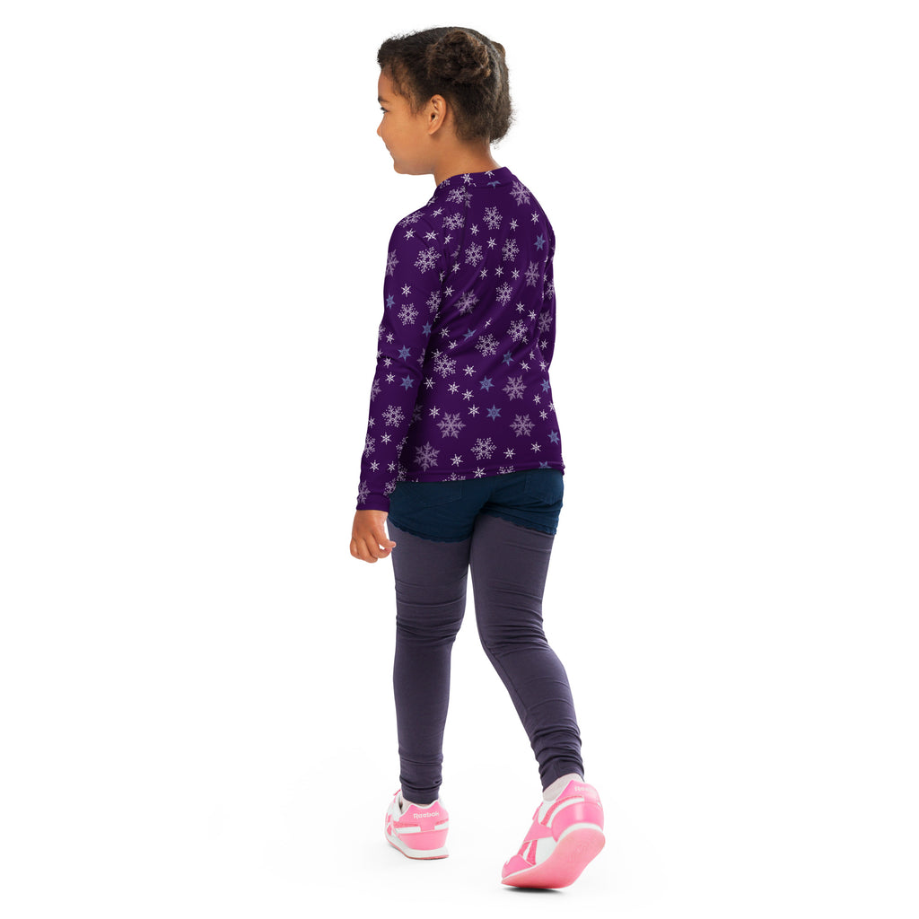 Kids purple long sleeve rash guard swim shirt with white and blue snowflake pattern and upf 50 plus sun protection