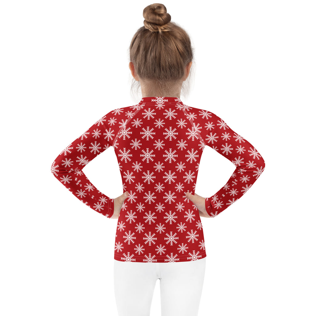 Kids red long sleeve rash guard swim shirt with white snowflake pattern and UPF 50 plus for sun protection