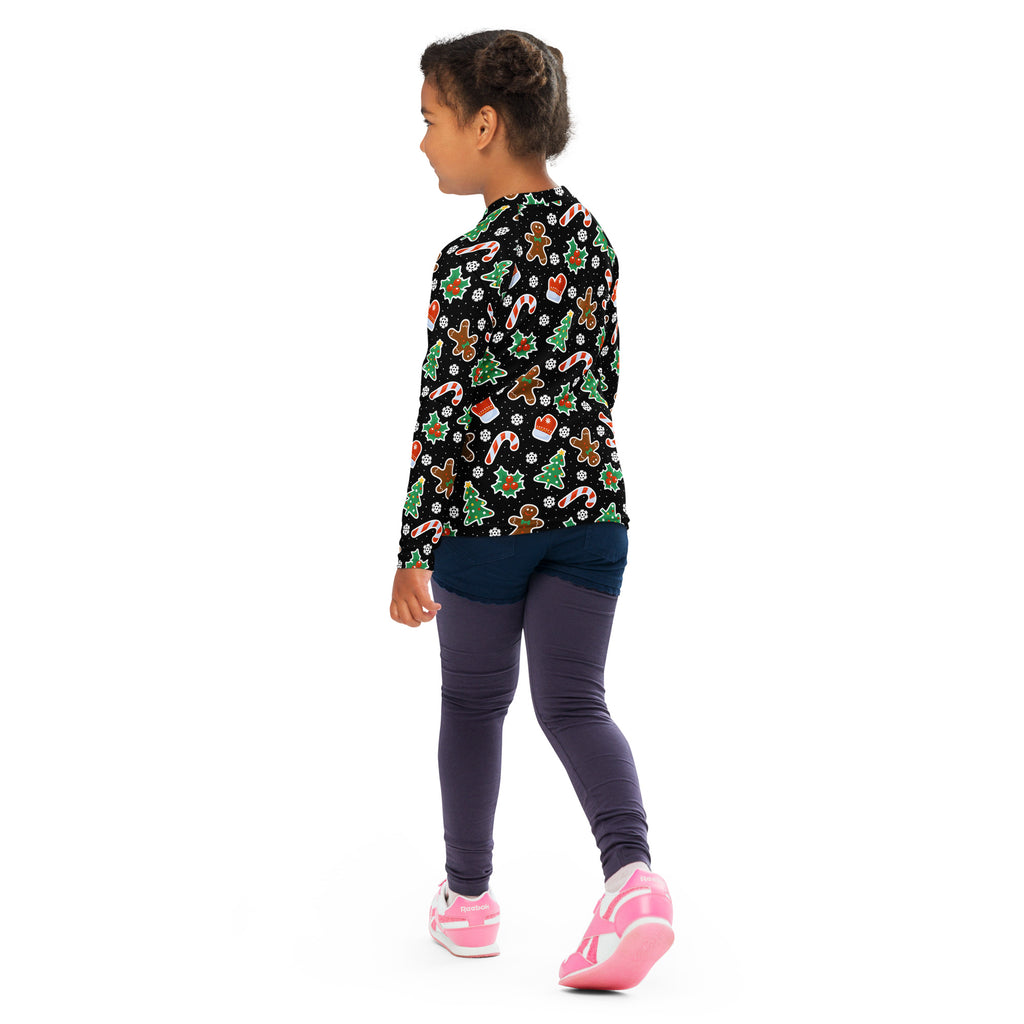Kids black long sleeve rash guard swim shirt with upf 50 plus featuring festive gingerbread man candy cane and tree patterns