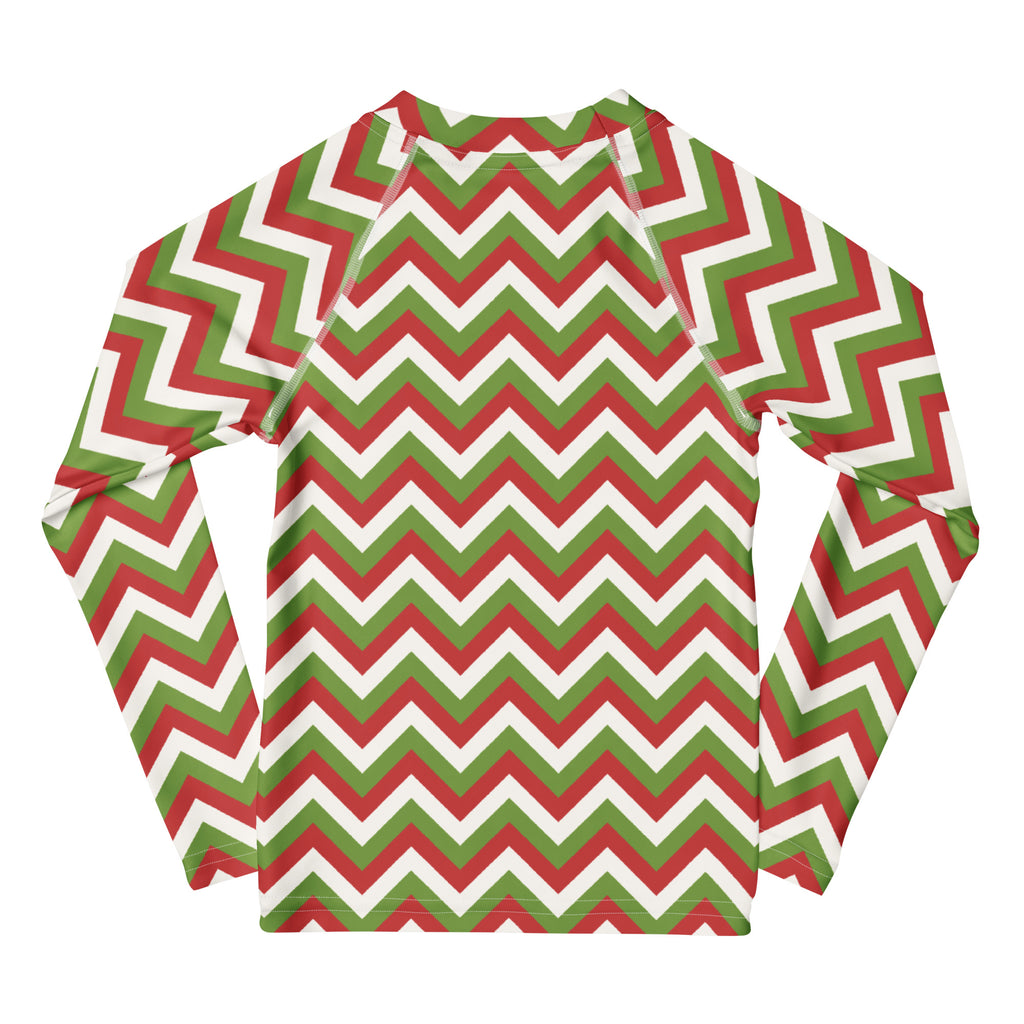 A kids long-sleeve rash guard swim shirt with a red green and white chevron pattern and upf 50+ sun protection