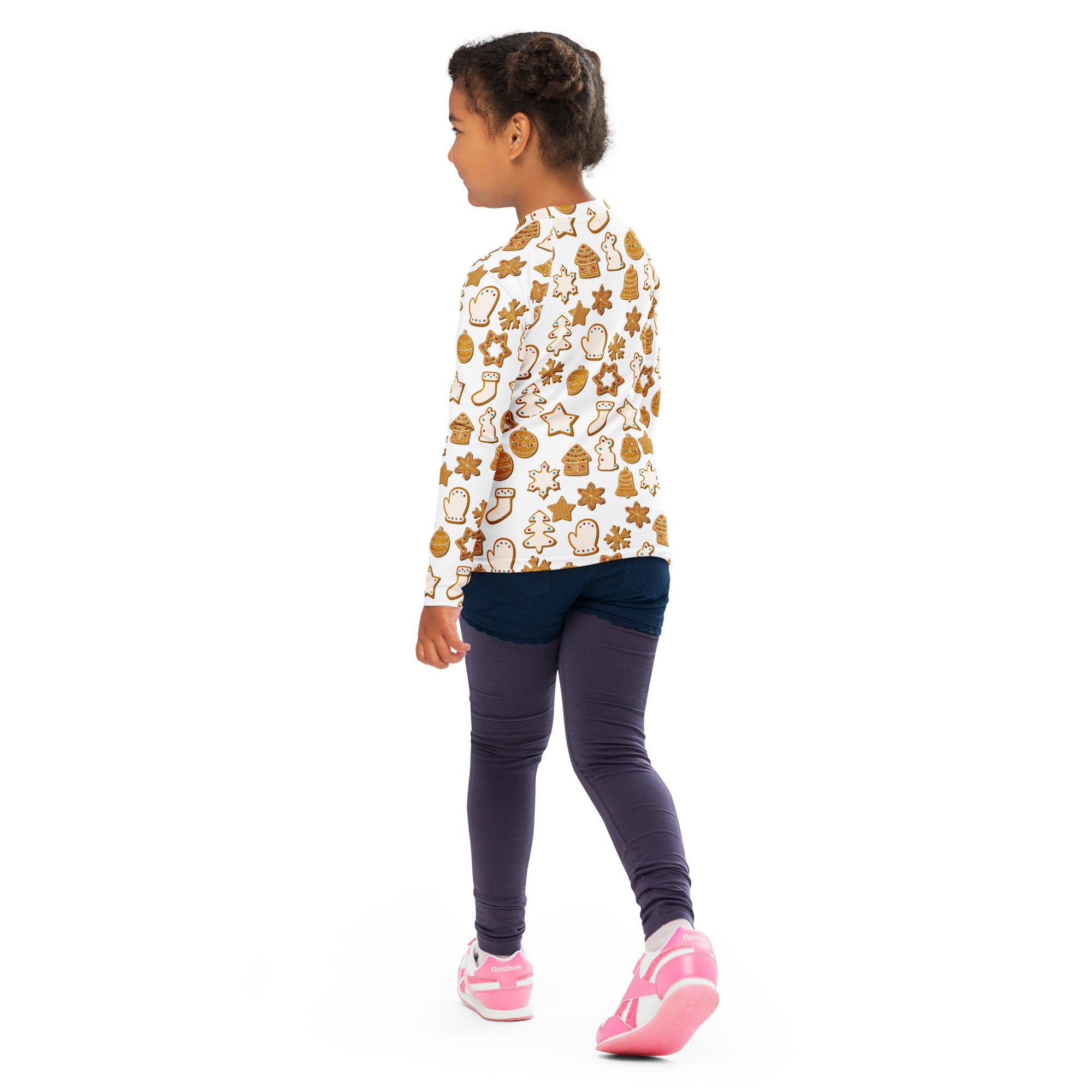 White long-sleeved kids rash guard swim shirt with festive brown gingerbread cookie pattern and upf 50+ protection