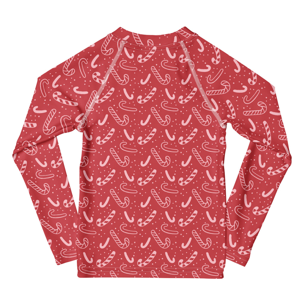 Kids red candy cane long sleeve rash guard swim shirt with white pattern small dots and upf 50 plus sun protection