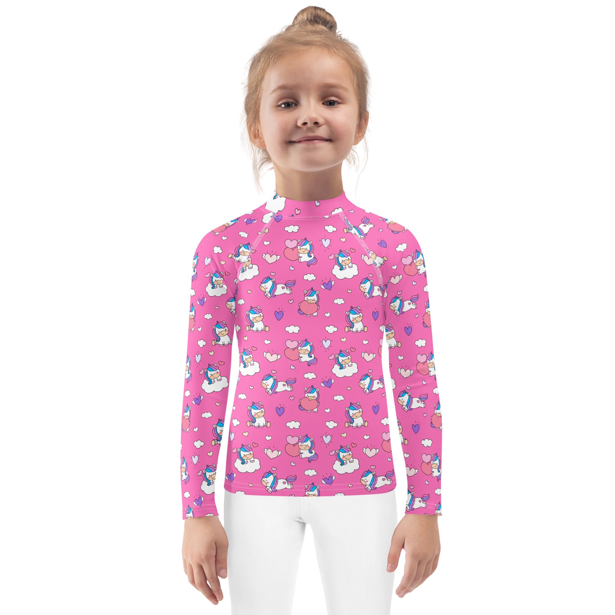 Pink long sleeve girls rash guard swim shirt with playful unicorn and cloud pattern and upf 50 plus protection
