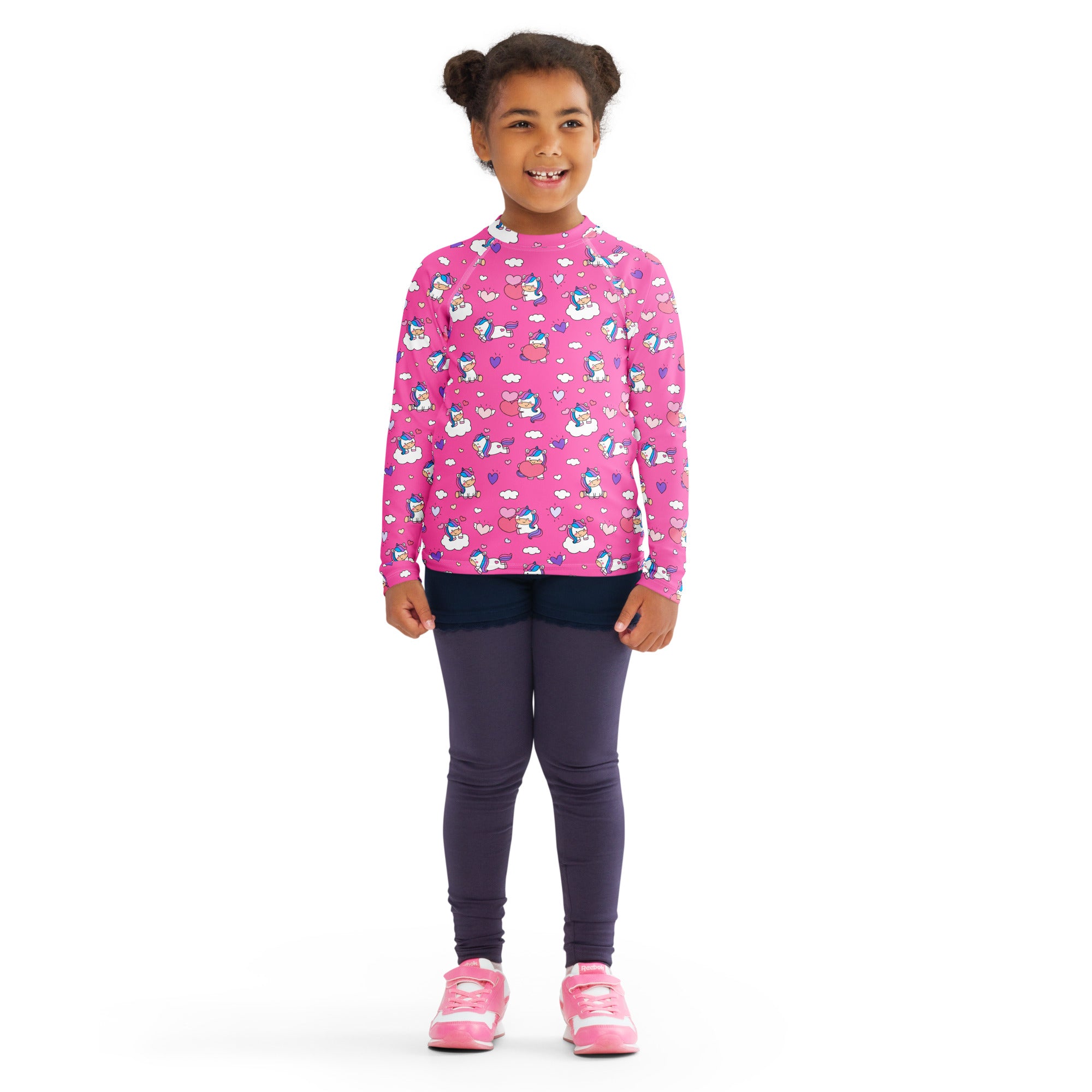 Girls pink long sleeve rash guard swim shirt with playful unicorn hearts pattern and upf 50 plus sun protection