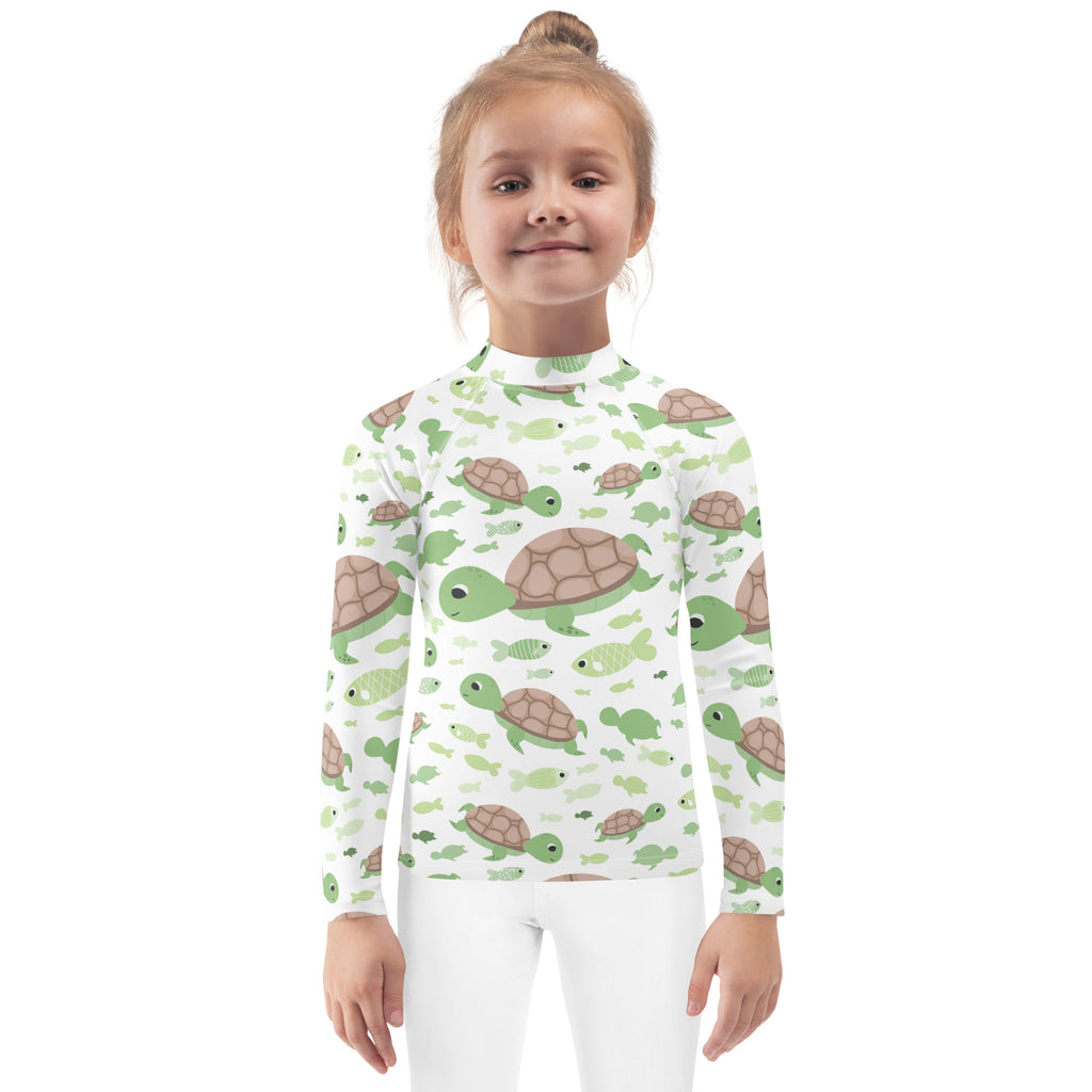 Kids green sea turtle long sleeve rash guard swim shirt with upf 50 plus featuring white fabric and playful turtle and fish pattern