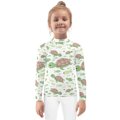 Kids green sea turtle long sleeve rash guard swim shirt with upf 50 plus featuring white fabric and playful turtle and fish pattern