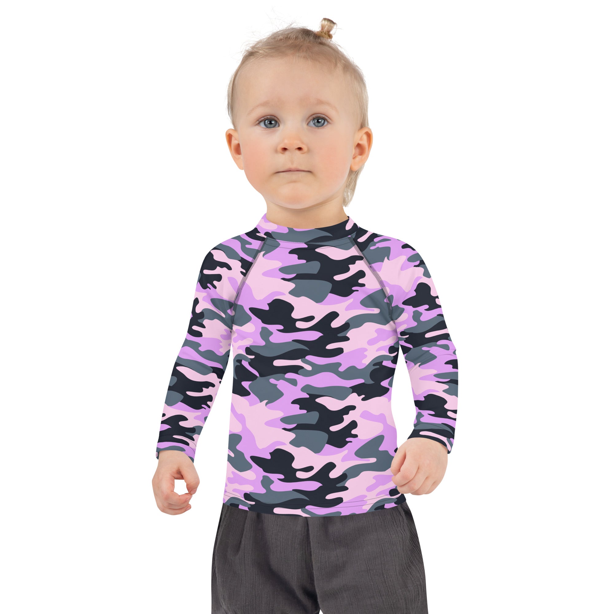 A child wearing a girls purple camouflage long sleeve rash guard swim shirt with upf 50 plus protection