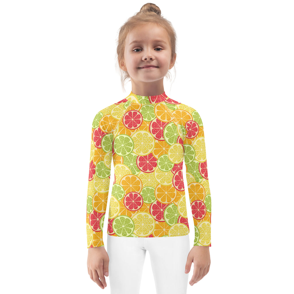 Kids citrus fruit long sleeve rash guard swim shirt with UPF 50+ featuring a bright sliced citrus pattern