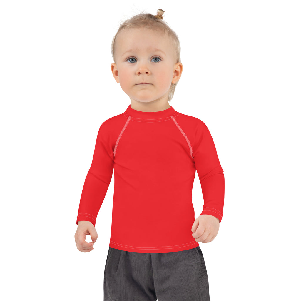 Kids red long sleeve rash guard swim shirt with UPF 50 plus featuring bright red color and light gray seam detailing
