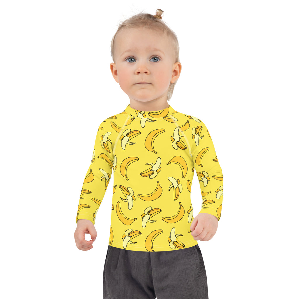 Kids yellow long sleeve rash guard swim shirt with playful banana pattern and upf 50 plus sun protection