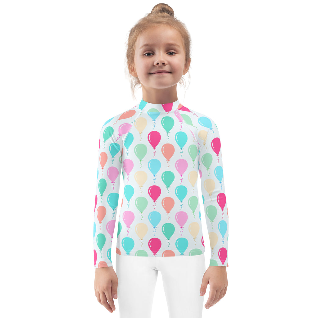 A kids birthday balloons long sleeve rash guard swim shirt with upf 50 plus featuring multicolored balloon patterns on white
