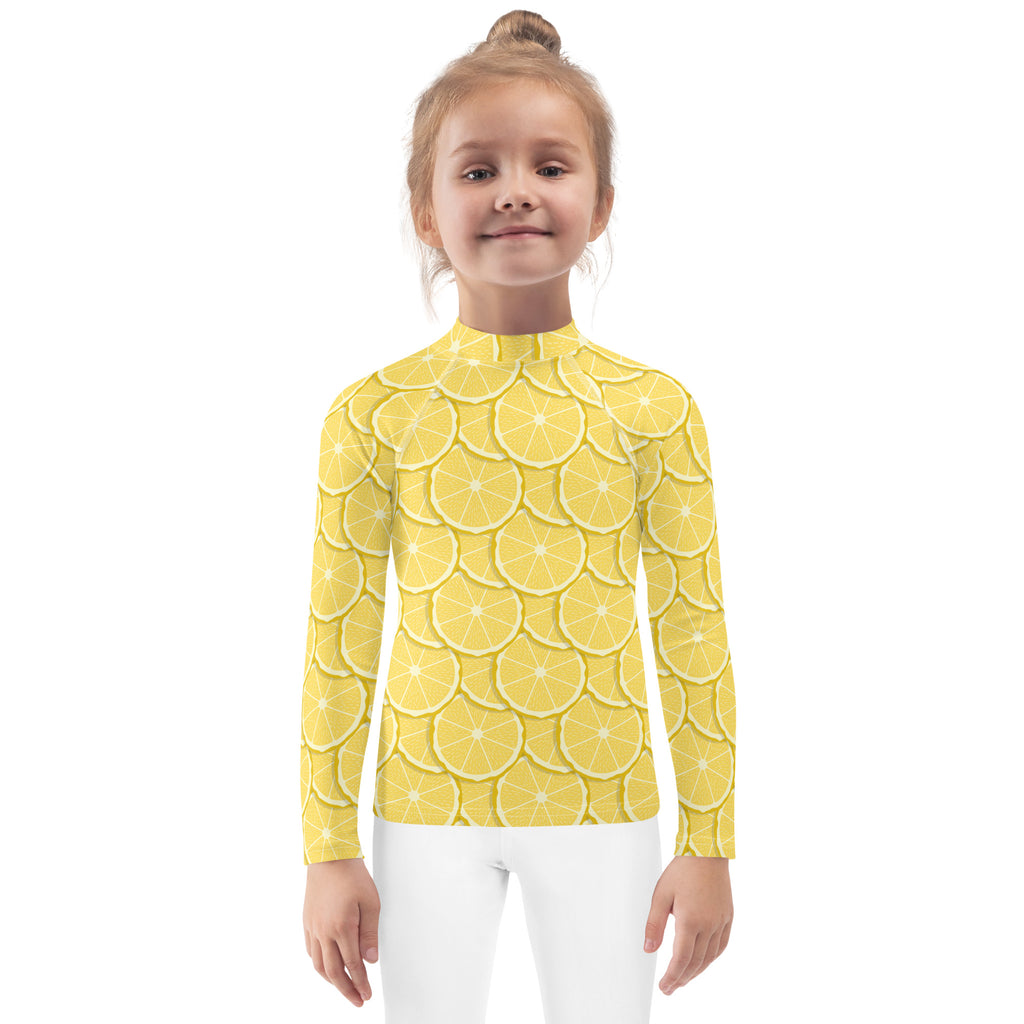 Kids lemon long sleeve rash guard swim shirt with upf 50 plus featuring yellow fabric patterned with sliced lemons
