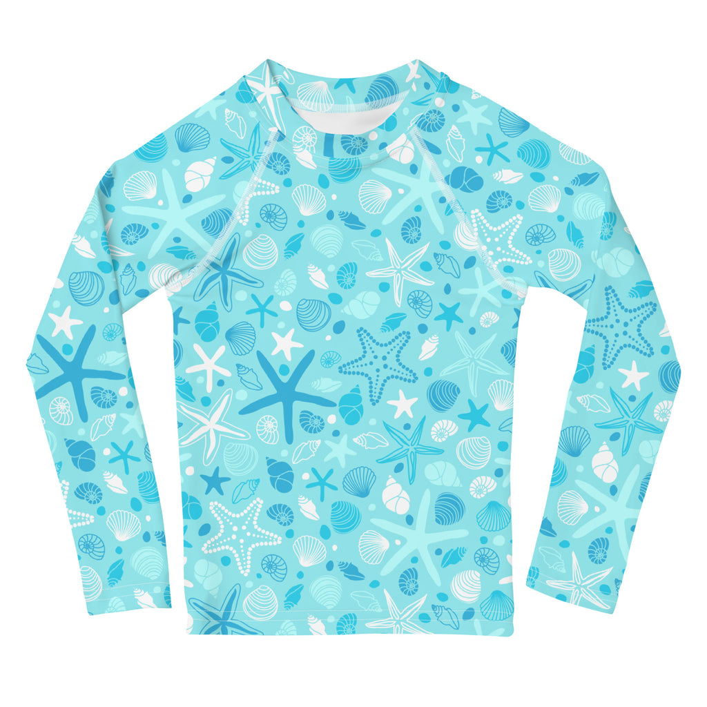 A light blue kids long sleeve rash guard swim shirt with starfish and seashell pattern and upf 50 plus protection