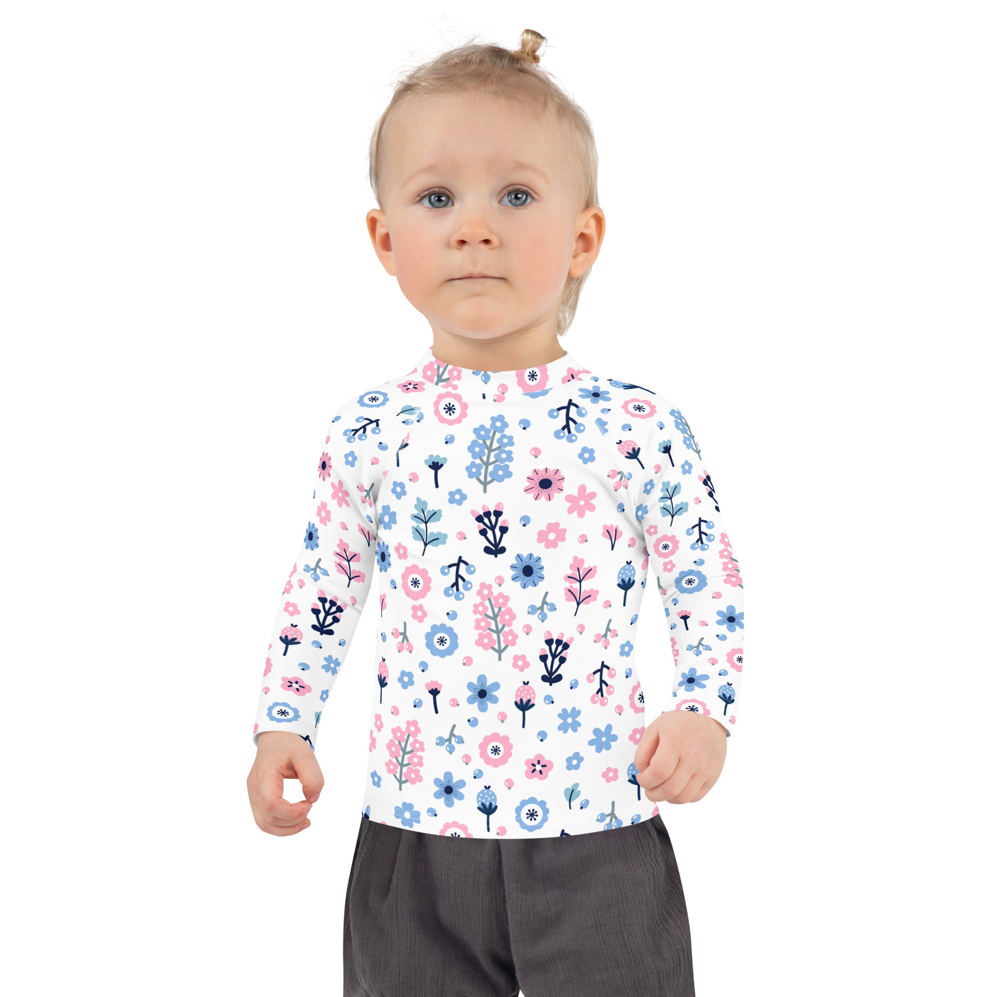 Girls pink and blue floral long sleeve rash guard swim shirt with upf 50 plus featuring playful flower and bird pattern