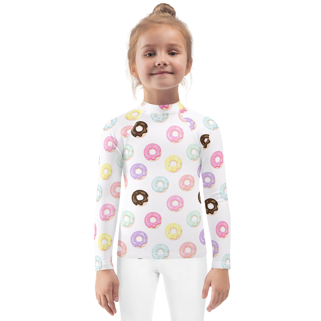 White long-sleeved kids rash guard swim shirt with pastel donut pattern and upf 50 plus for sun protection