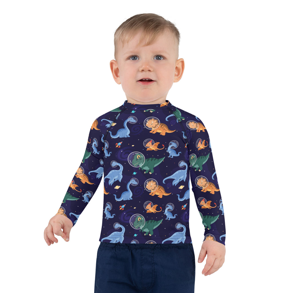 Kids dinosaurs in space long sleeve rash guard swim shirt navy blue with colorful astronaut dinosaur pattern and upf 50+ protection