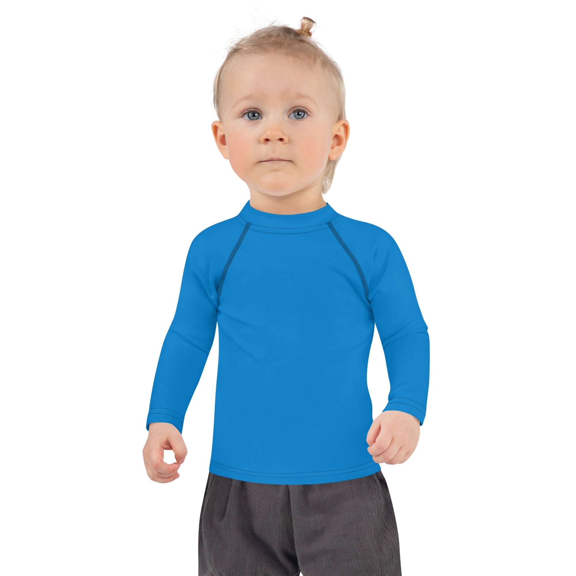 Kids navy blue long sleeve rash guard swim shirt with upf 50 and bright blue fabric with high collar and dark seam details