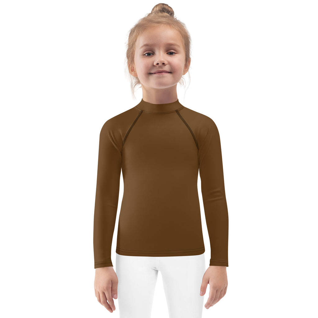 A child wearing a kids brown long sleeve rash guard swim shirt with UPF 50 plus for sun protection