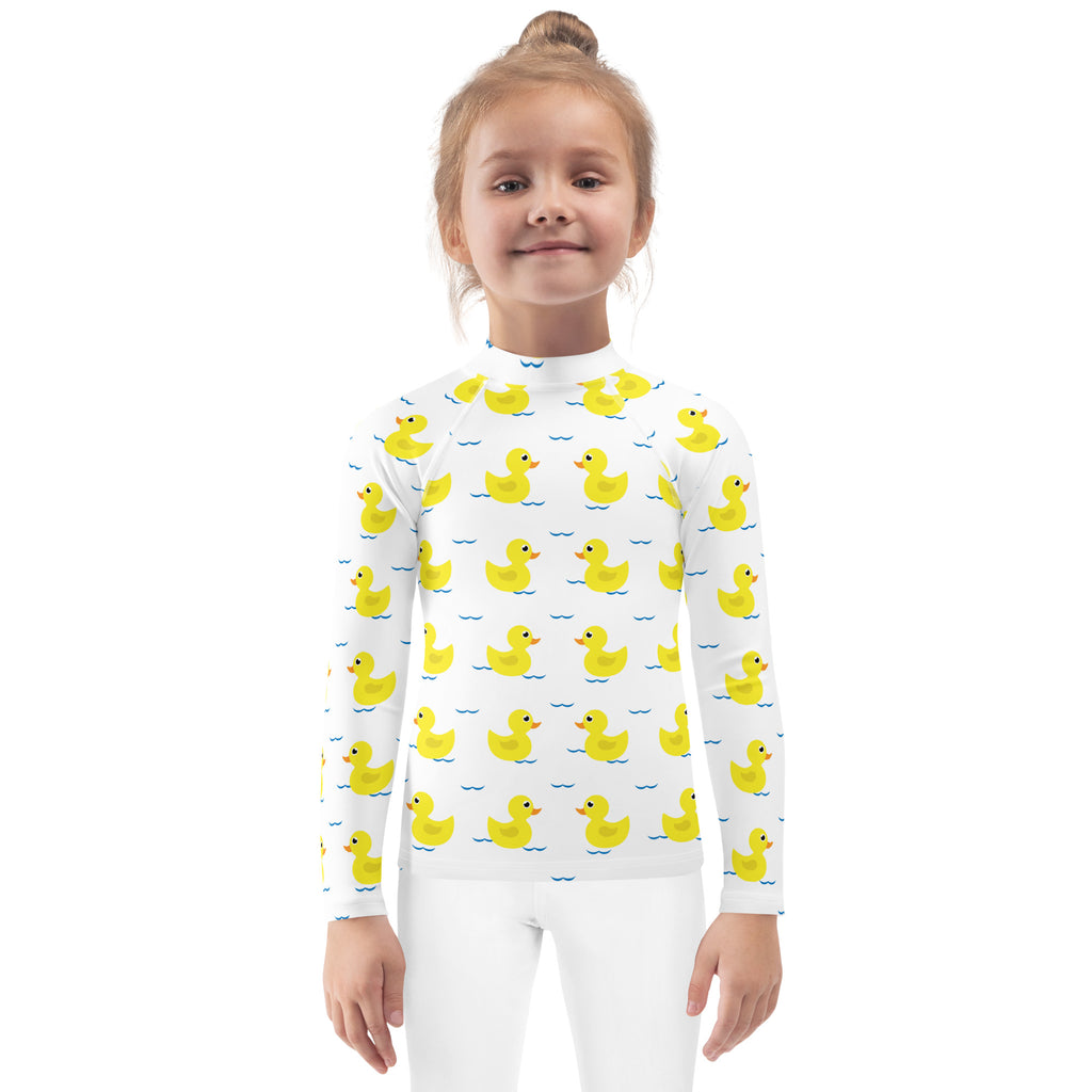 White long sleeve rash guard with yellow rubber ducks and blue waves for kids swim shirt with UPF 50 plus protection