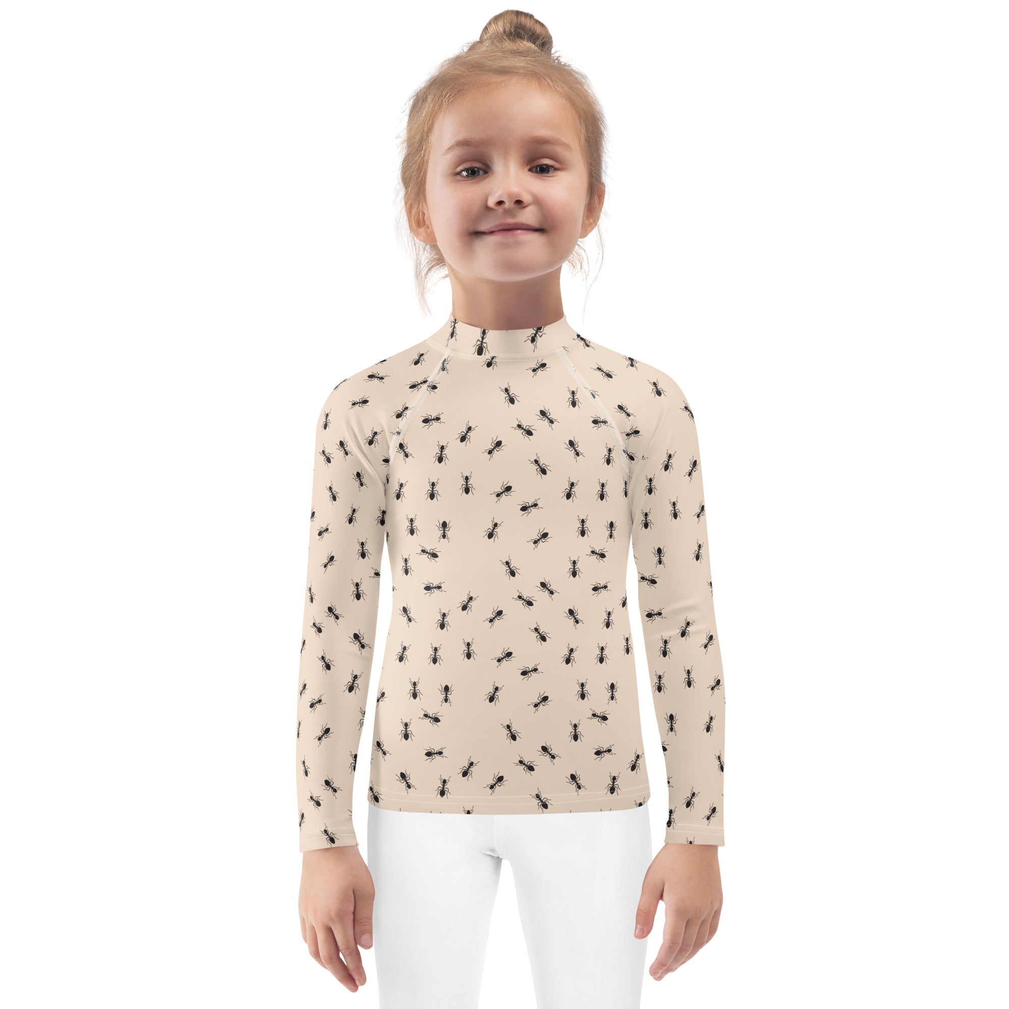 Beige kids long-sleeve high-neck rash guard swim shirt with black ant pattern and UPF 50 plus sun protection