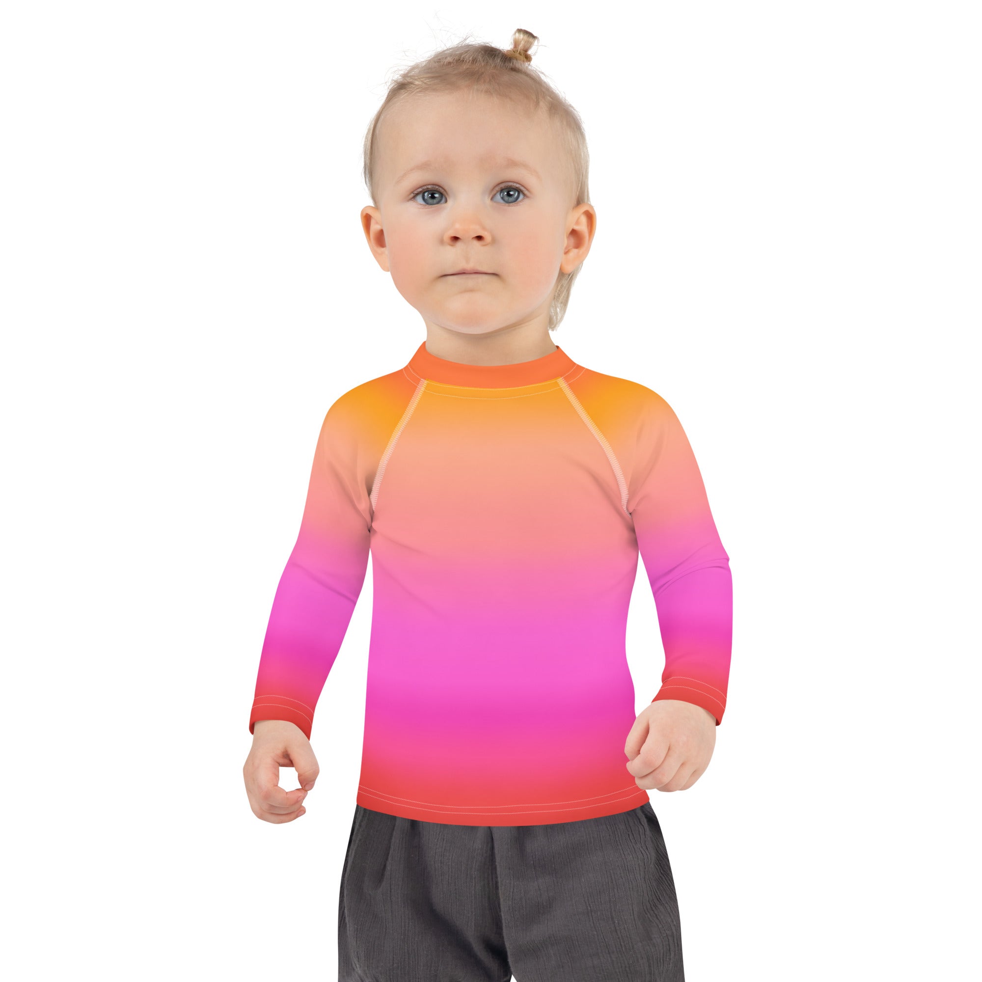 Girls sunset ombre long sleeve rash guard with a vibrant orange to pink red gradient and UPF 50 plus sun protection