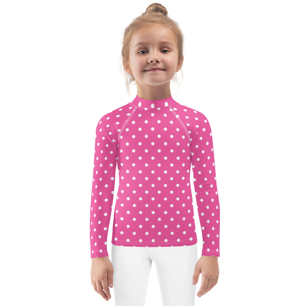 Girls pink long sleeve rash guard swim shirt with white polka dots and upf 50 plus for sun protection