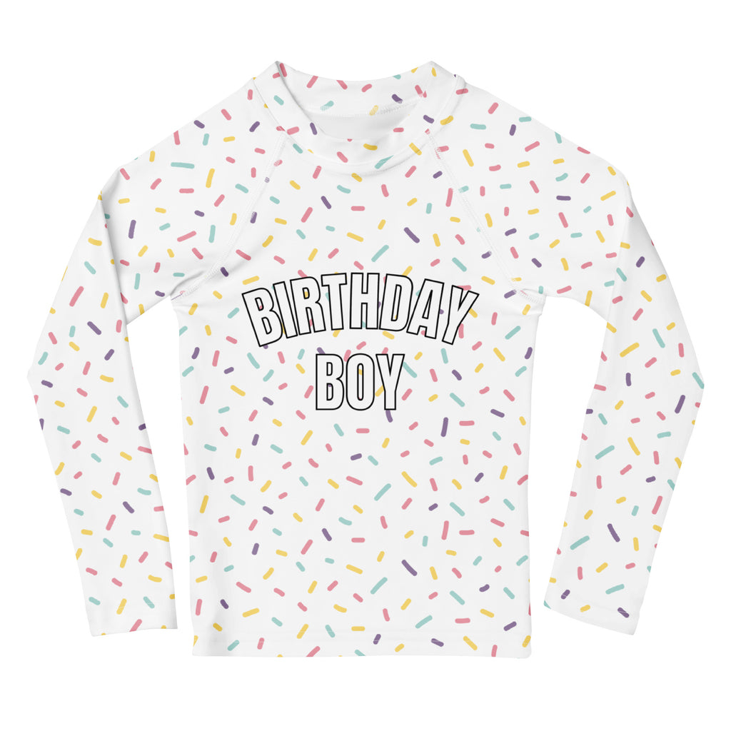 White long sleeve rash guard swim shirt with colorful sprinkles and birthday boy lettering with upf 50 plus protection