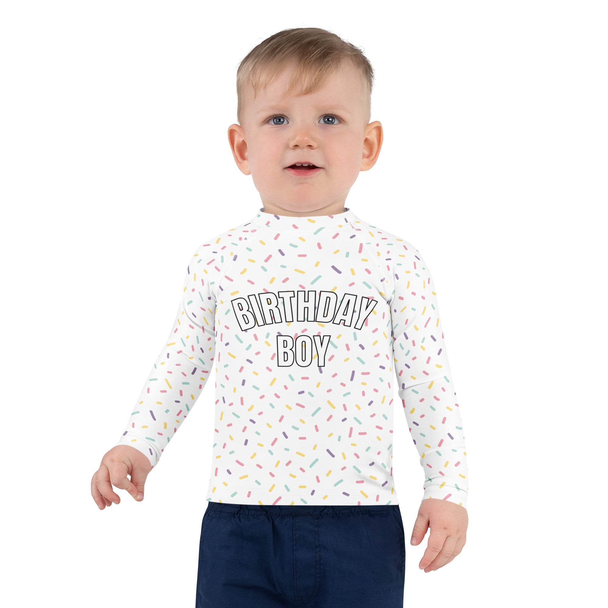 White long-sleeved rash guard swim shirt with birthday boy text colorful sprinkle pattern and upf 50+ protection