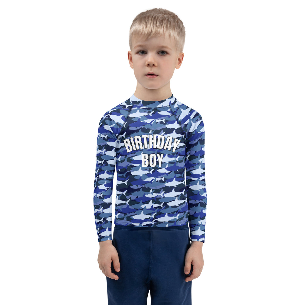 Blue and white shark-patterned long-sleeved rash guard with birthday boy print on chest for custom birthday use