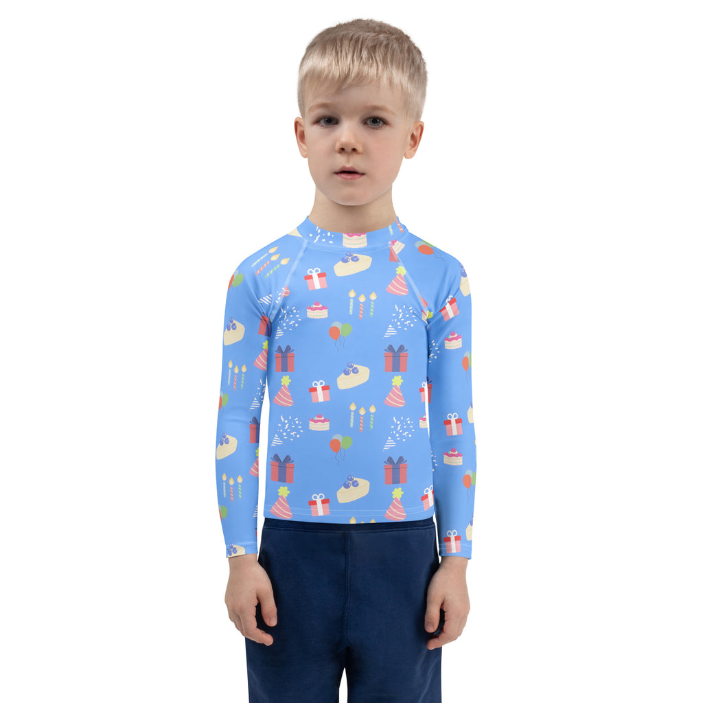 Kids blue birthday party long sleeve rash guard swim shirt with upf 50 plus featuring birthday cakes gifts and party hats