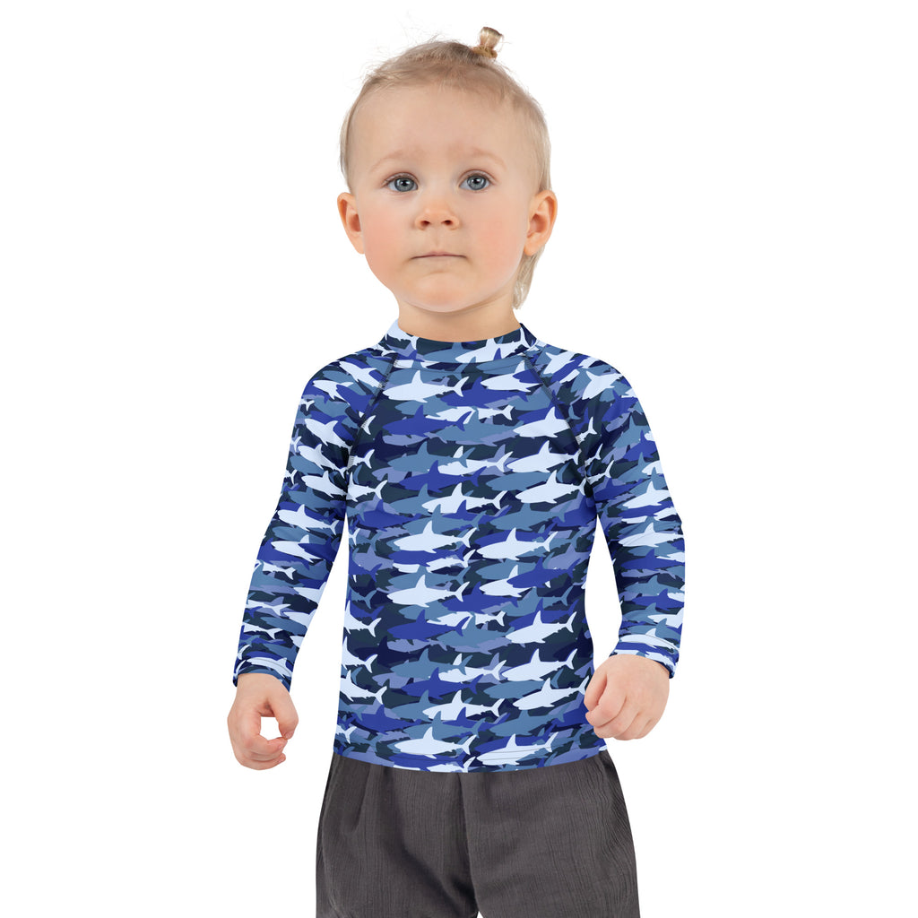 Kids blue shark long sleeve rash guard swim shirt with UPF 50+ featuring blue and white shark pattern