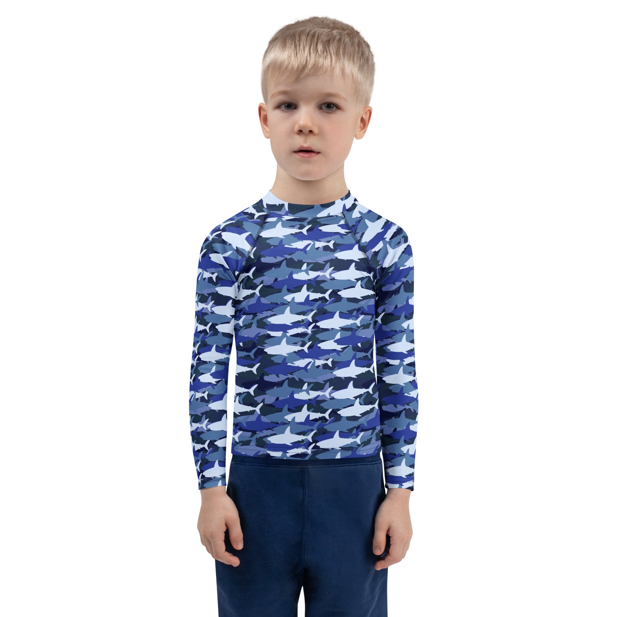 Kids blue and white shark-patterned long sleeve rash guard swim shirt with UPF 50 plus for sun protection