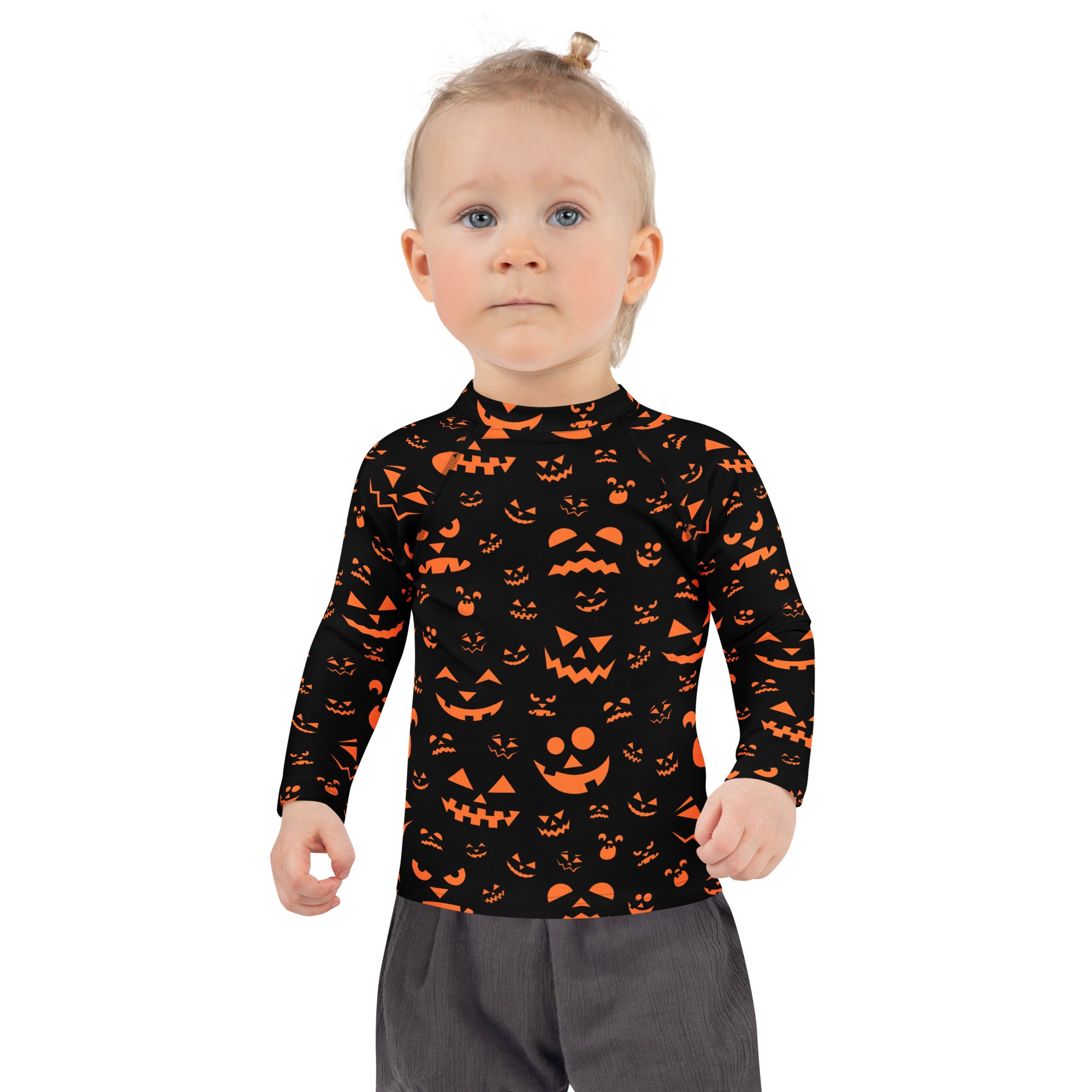 Kids black long sleeve swim shirt with orange jack-o-lantern faces and upf 50 plus for halloween protection