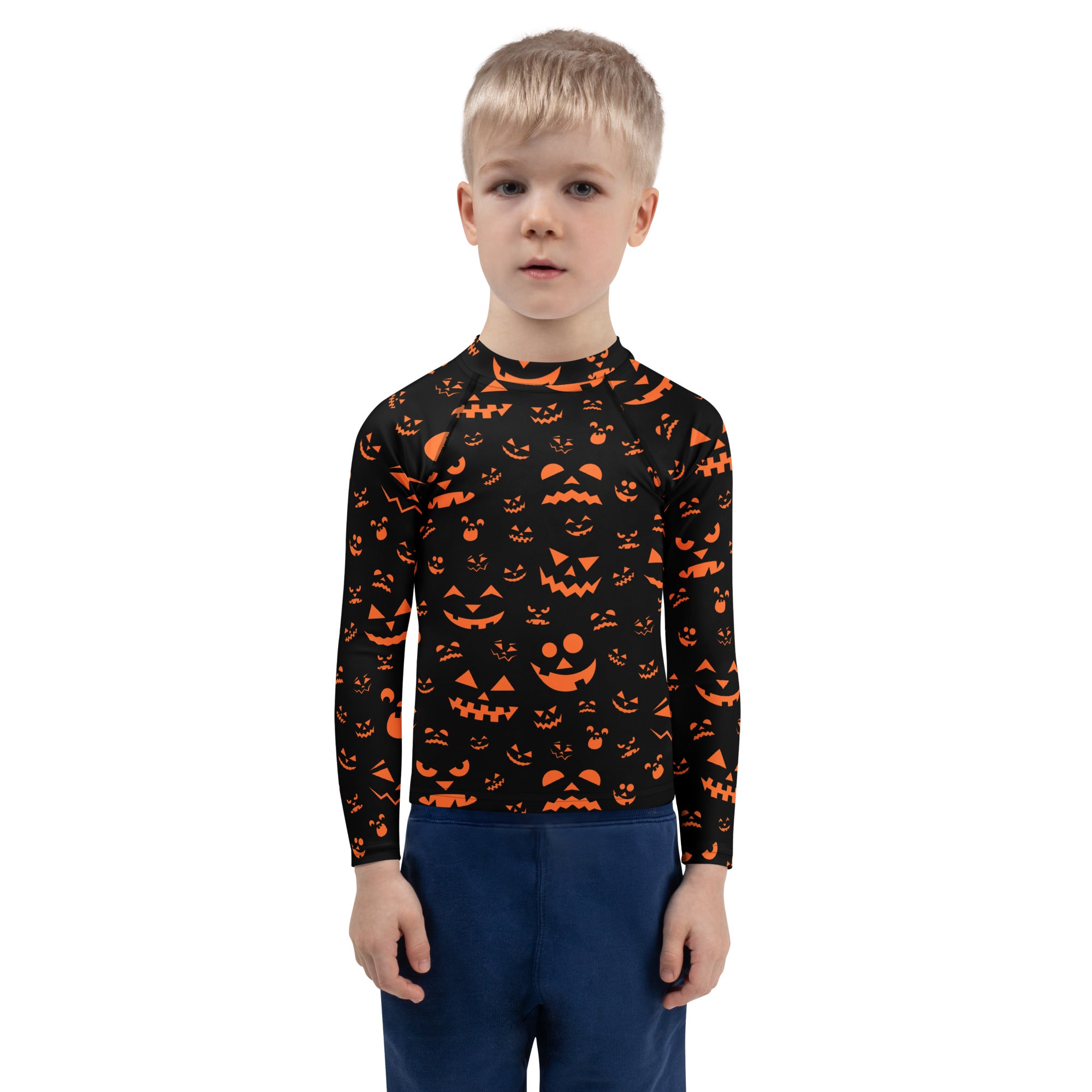 Black long-sleeved rash guard with vibrant orange jack-o-lantern faces for kids with UPF 50 plus sun protection