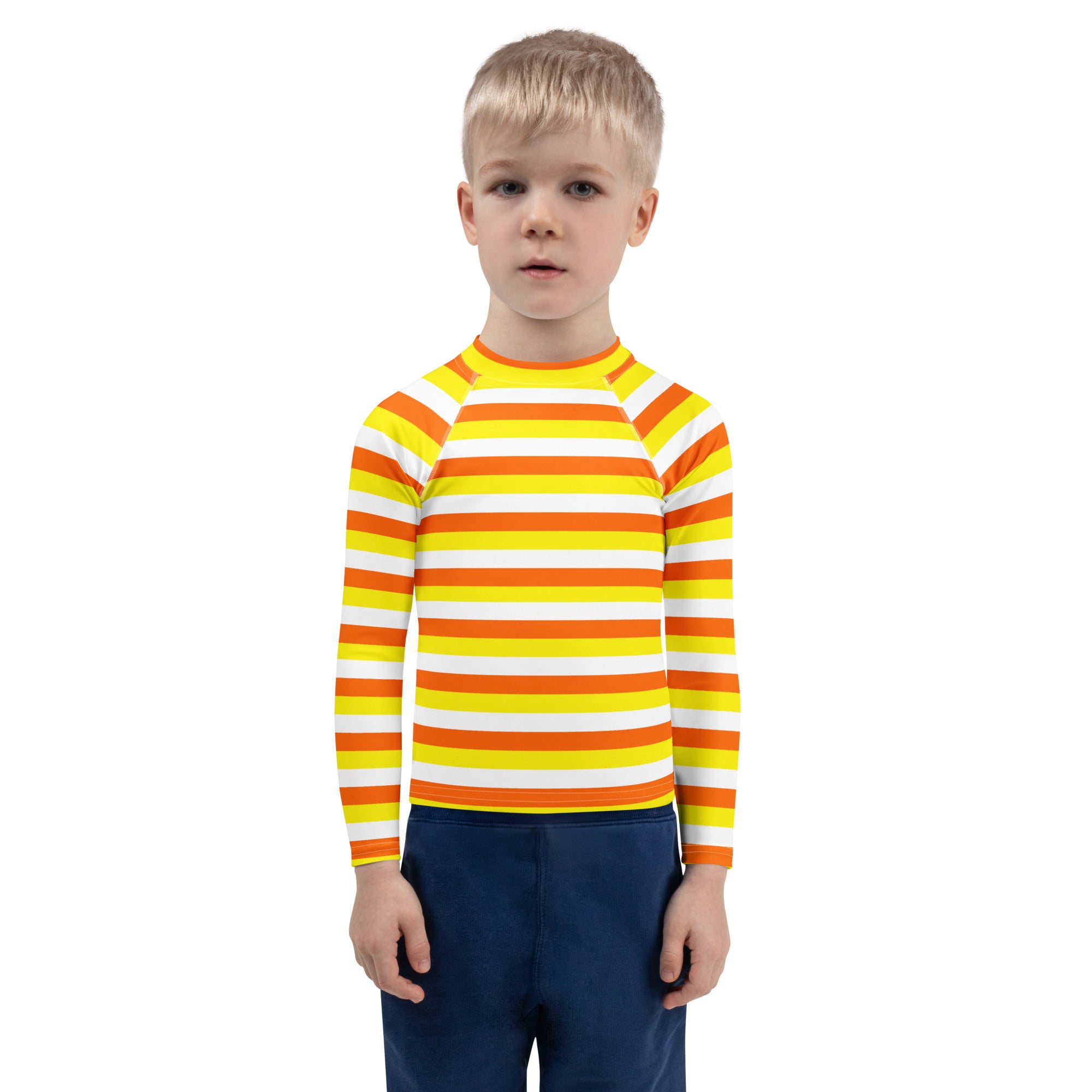 A kids candy corn stripes long sleeve rash guard in vibrant orange yellow with white accents and UPF 50 plus protection