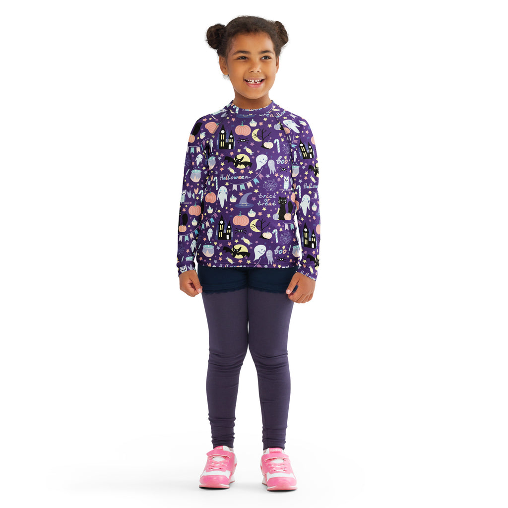Kids spooky halloween long sleeve rash guard swim shirt in purple with ghost pumpkin bat and castle graphics and upf 50+ protection