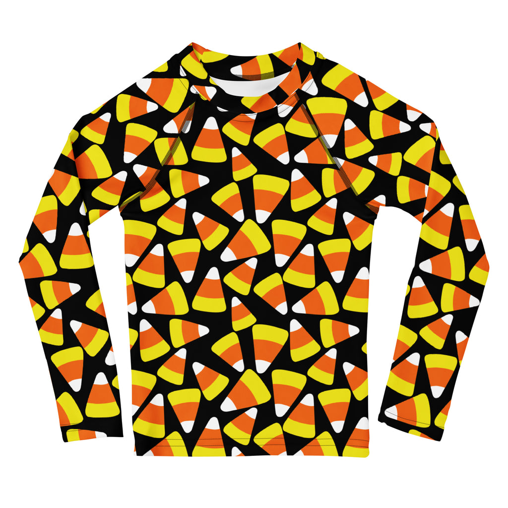 Kids candy corn halloween long sleeve rash guard swim shirt with upf 50 plus featuring vibrant candy corn pattern