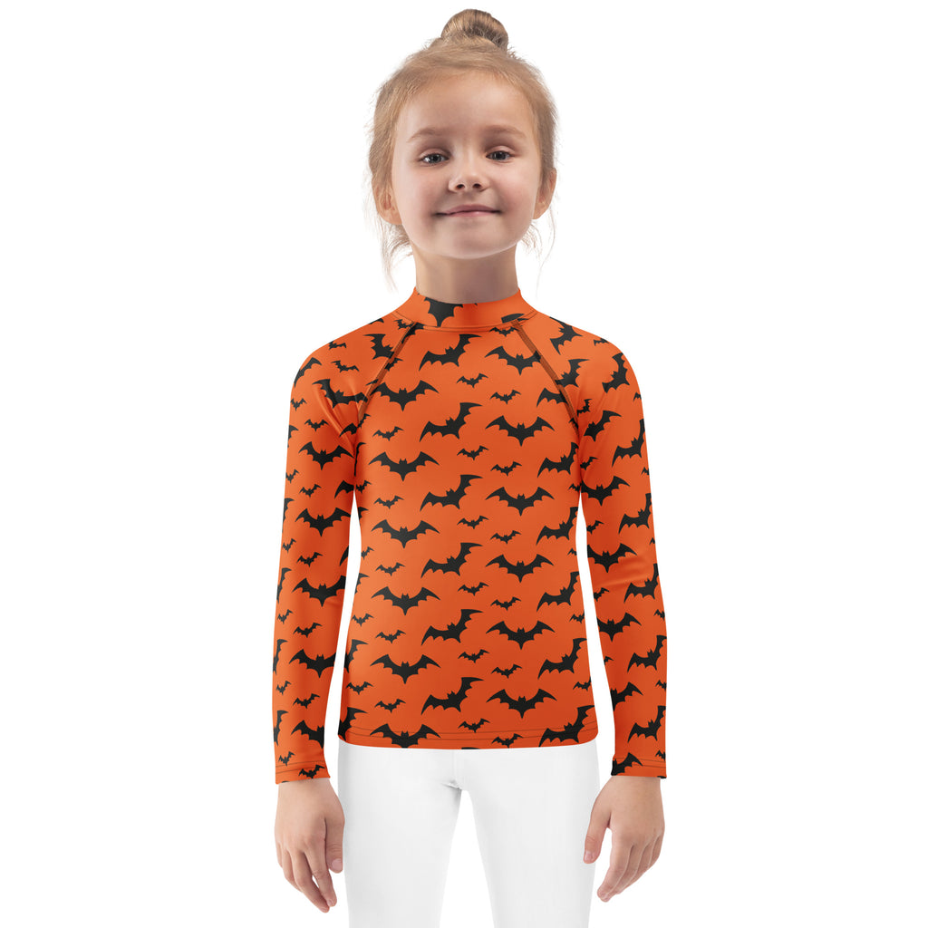 Kids orange long sleeve rash guard swim shirt with black bat pattern and upf 50 plus for halloween use