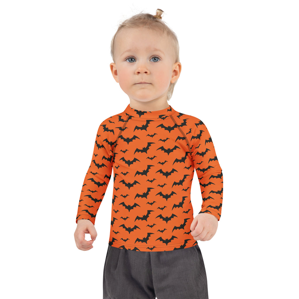 Kids orange long sleeve rash guard swim shirt with black bat pattern and UPF 50+ sun protection for Halloween