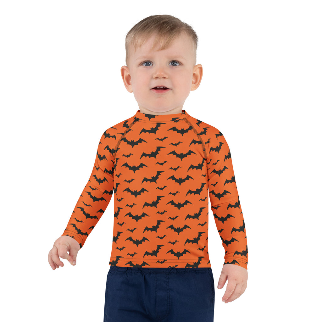 Kids orange long sleeve rash guard swim shirt with black bat pattern and upf 50 plus for halloween