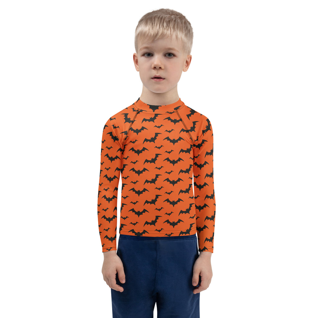Kids orange long sleeve rash guard swim shirt with black bat pattern and UPF 50 plus for Halloween swimming
